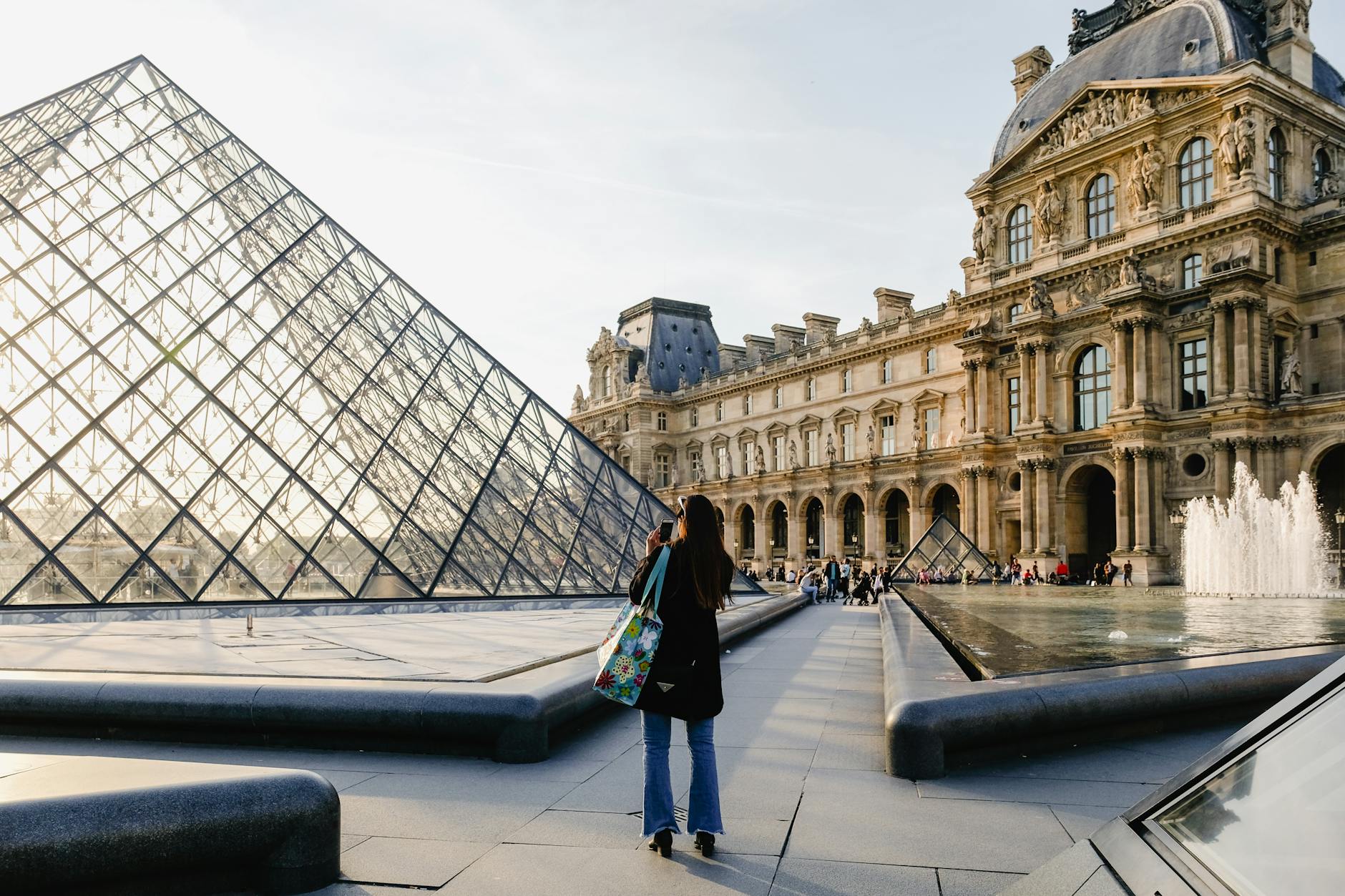 Couple strolling through a Paris neighborhood wearing understated autumn layers
